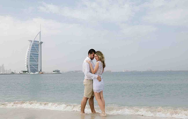 couple posing on the beach in Dubai