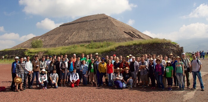 group of tourists visiting the pyramids