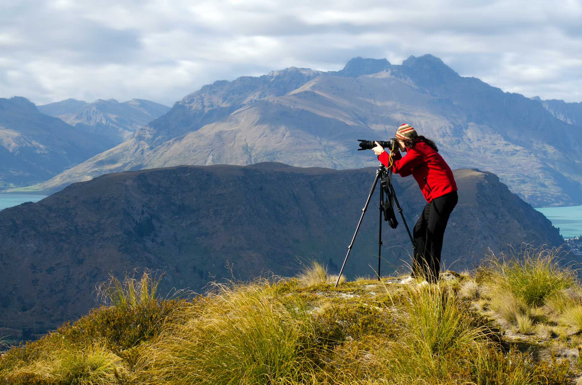 traveler with camera in a mountain